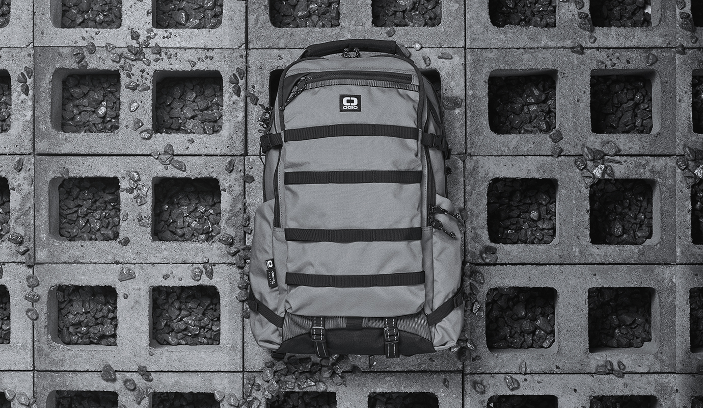 OGIO Charcoal backpack on gray cinder blocks